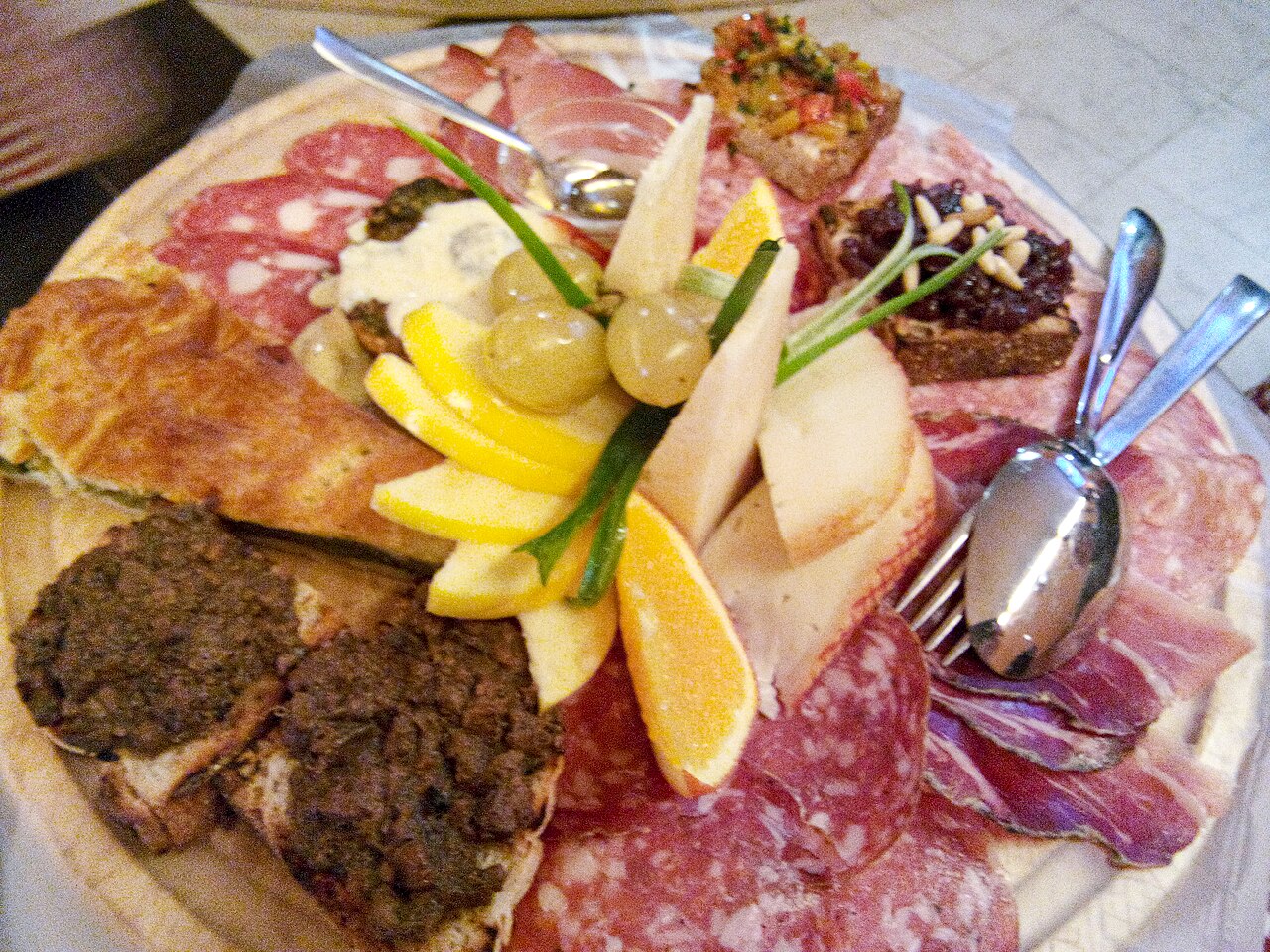 A shared plate of Tuscan-style antipasto